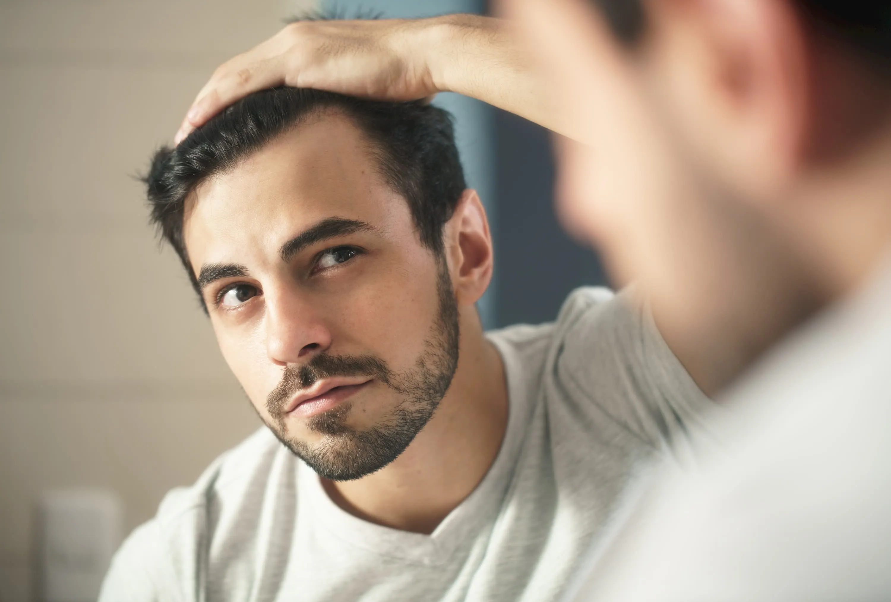 Guy looking at his haircut